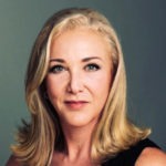 Blonde woman with blue eyes looking at the camera