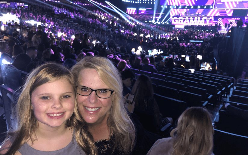 Tricia McKinney and daughter at the Grammy Awards, embracing entrepreneurship.