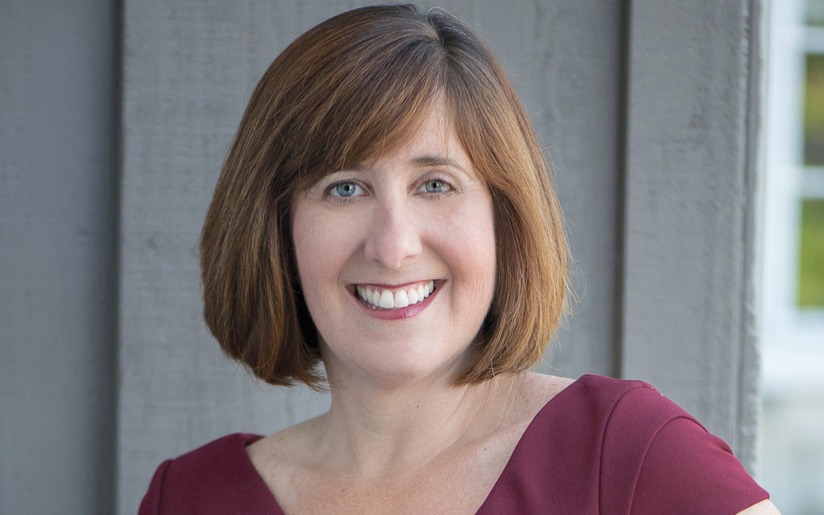 Lori Reddy, Project Precision, People Person, smiles in a professional headshot.