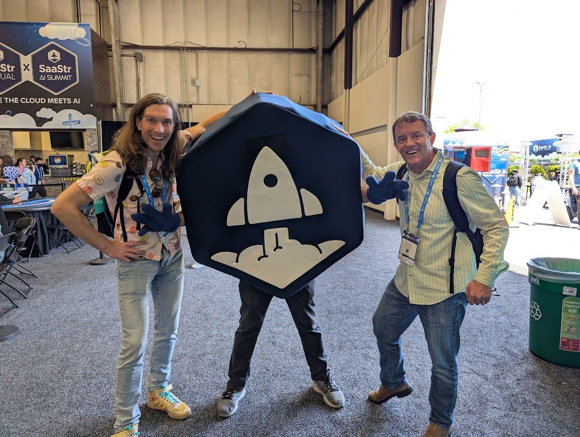 Two men and a person with a SaaStr logo at the SaaStr Annual Summit.